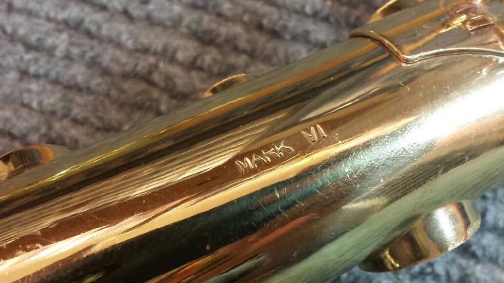 Some Mark VI's have a Mark VI *stamp* on the body. Some are engraved. Most do not have this on the body.