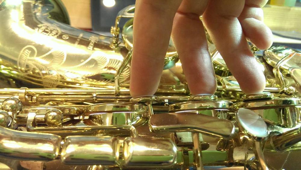 The horn with the band-aids in the bell. Pretty leaky!