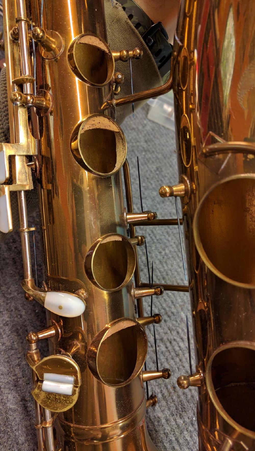 Sigh. Tonehole crescents all over this horn. I am not a big fan of tonehole crescents, and when you see a bunch all on one stack of the horn you gotta wonder why they didn't just lower the action a bit if the right hand stack was sharp.