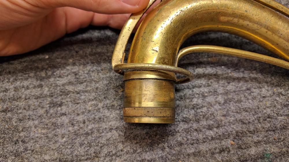 This is original! Conn had a neck that had a very shallow groove machined in it for a cork sealing surface.