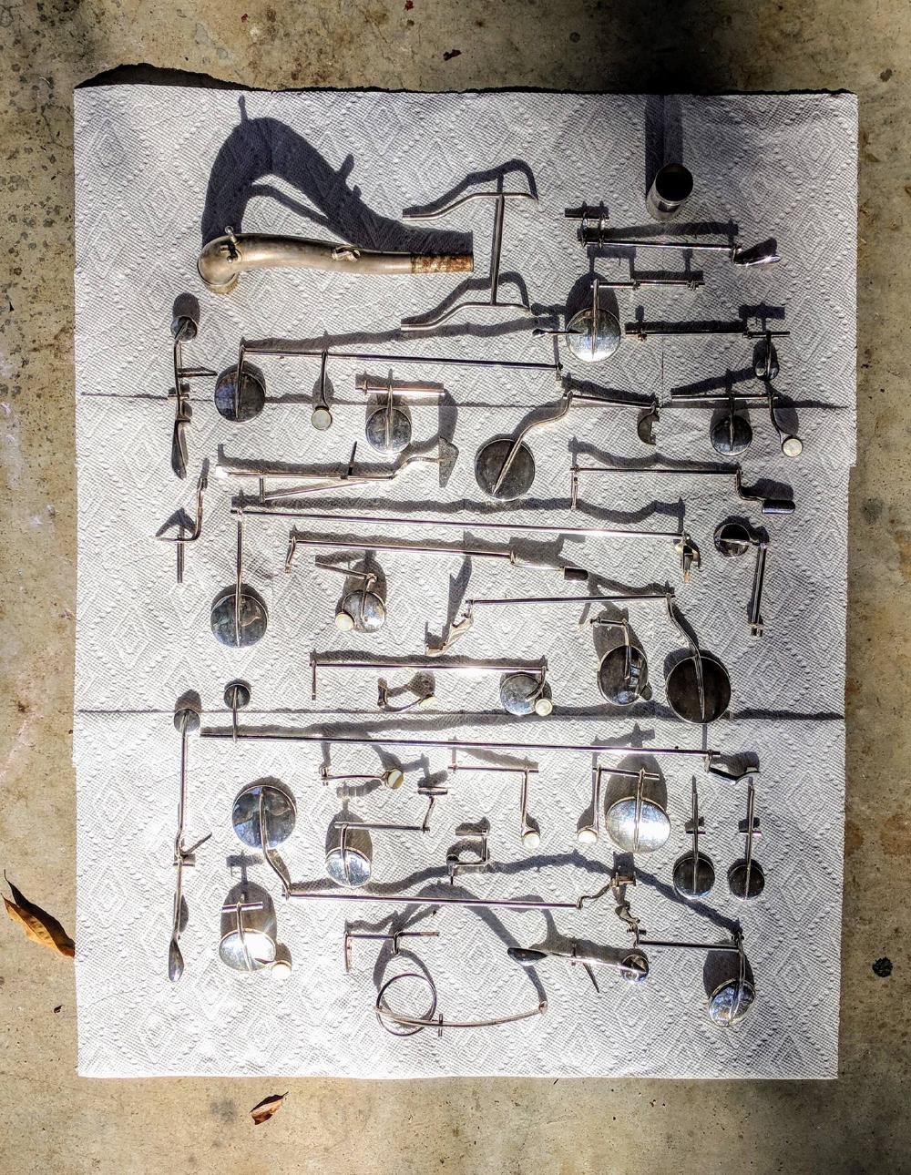 Keys laid out to be sprayed with Hagerty's for polishing.