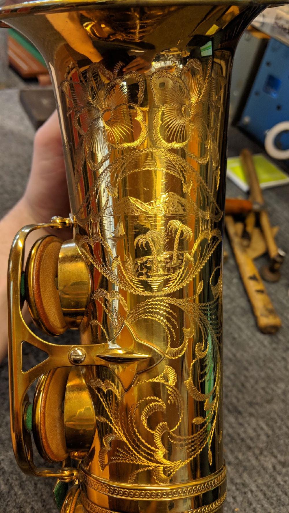 Nice palm trees and mountains scene on a Selmer Balanced Action alto that is still sporting its original pads.