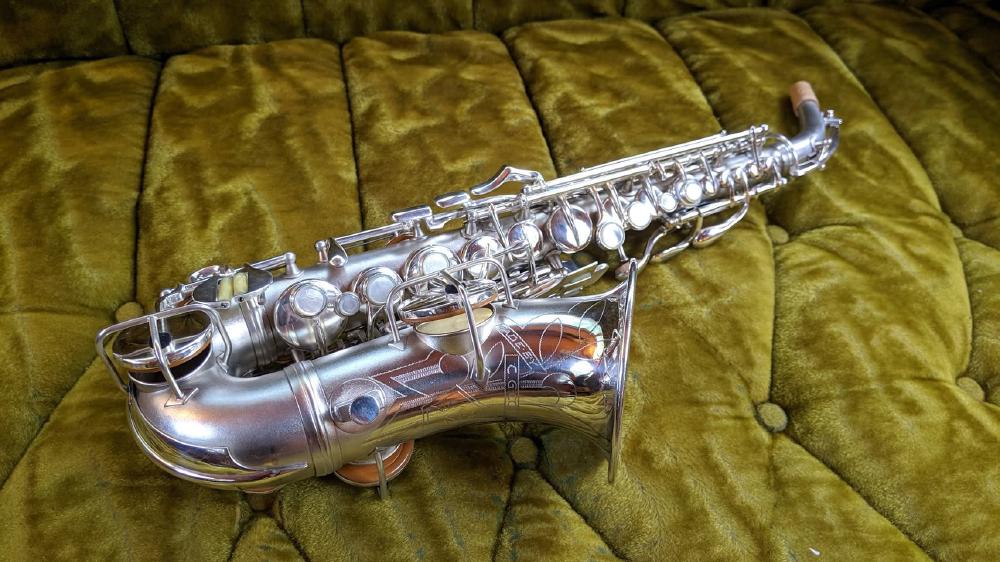 Conn 4M soprano with 'naked lady' engraving in silver plate.