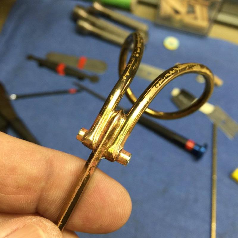 Soldered into key tube.
